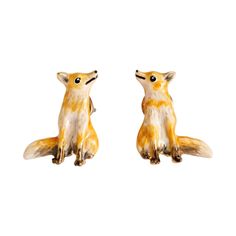 Elevate your accessory collection with our hand-painted enamel fox charm earrings, each meticulously crafted to showcase the delightful details of a woodland fox. Hand-carved to perfection, these earrings capture the essence of this beloved creature with a luxurious 14k gold-plated zinc alloy finish that complements any outfit. Measuring 14 mm x 10 mm, these earrings strike the perfect balance between elegance and subtle statement, making them a charming addition to your jewellery collection.  A Fox Charm, Fable England, Fox Earrings, Woodland Fox, Cotton Pouch, Vintage Deer, Gifts For Nature Lovers, Jewellery Collection, Nature Lovers