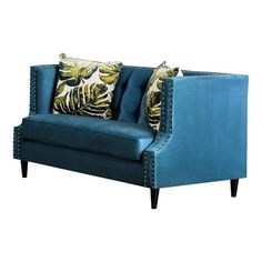 a blue couch with two pillows on it's back and one arm facing the camera