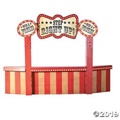 an amusement park ride with signs on it's sides and the words step right up