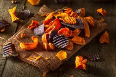 a pile of dried fruit sitting on top of a wooden table