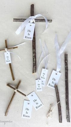 the cross is made out of sticks and paper tags