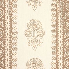 a brown and white rug with flowers on the bottom, two rows of lines in the middle