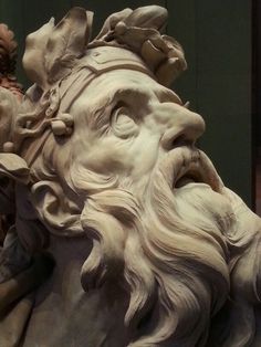 a statue of a man with long hair and beard