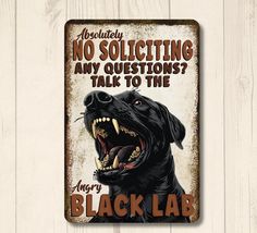 there is a sign with a black dog on it that says, absolutely no solicing any questions? talk to the angry black lab