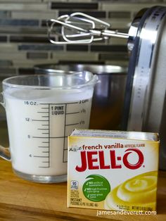 a blender with a carton of jello next to it