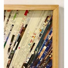 a wooden frame filled with lots of different types of papers