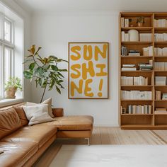 a living room filled with furniture and a book shelf