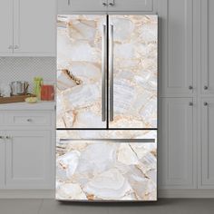 a white refrigerator freezer sitting in a kitchen next to an oven and counter top