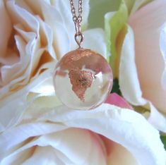 Handmade rose gold pendant made with jewelry grade resin and gold leaf 🌍  #レジン #アクセサリー #resin #resinart #resinjewelry #resincharms #resinjewellery #handmadejewelry #handmadenecklace #globetrotter #planetearth #rosegold #rosegoldjewelry #rosegoldjewellery #celestialjewelry #daintyjewelry #handcraftedjewelry #handcraftedaccessories #giftideas #pink #millenialpink #ハンドメイド #wanderlust #resinpendant #resinearth #crystalresin #celestial Necklace Resin, Handmade Rose, Rose Gold Pendant