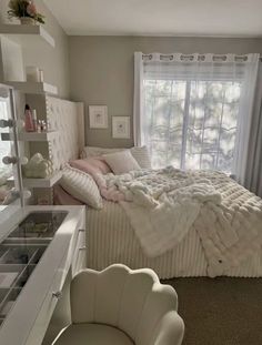 a bedroom with a bed, dresser and chair next to a window in the room