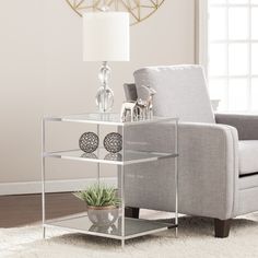 a living room scene with focus on the end table and chair next to the couch