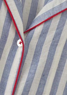 Unwind in our indigo blue stripe button down pyjama with pocket detailings. complimented by red piping and a v-necked collar the soft cotton is designed for serenity morning and night. 100% cotton.    size s/8 Pijama Satin, Caramel Baby, Clothing Making, Cotton Pajamas Women, Sewing Things, Pyjamas Womens, 2024 Style, Girls Sleepwear, Striped Pyjamas