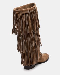 Upgrade your wardrobe with the SPUR fringe boot. These boots feature a fringe detailing that adds a touch of effortless style. Perfect for any occasion, these boots will elevate your look while providing comfort and durability. 1 inch heel height 14.5 inch shaft circumference 15 inch shaft height Suede upper material Synthetic lining Leather sock Synthetic sole Fit tip: If you are in between sizes, size up a half-size Imported Casual Leather Fringe Boots, Leather Fringe Boots For Fall, Casual Winter Boots With Fringe, Casual Fringe Winter Boots, Casual Winter Fringe Boots, Winter Fringe Ankle Boots, Casual Suede Fringe Boots, Casual Fringe Boots For Fall, Winter Suede Boots With Tassels