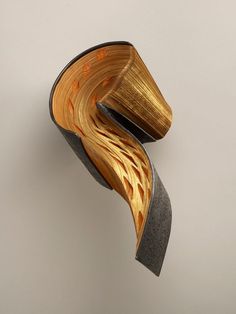 an artistic sculpture made out of wood and metal