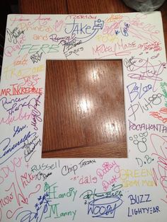 a wooden frame with writing all over it