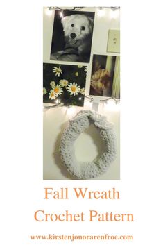 a crochet wreath with lights around it and pictures on the wall behind it