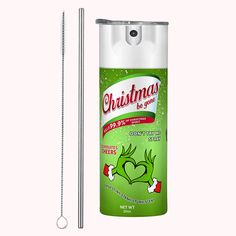 a can of christmas deodorant next to a stainless steel straw with the lid open