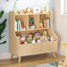 a wooden book shelf with stuffed animals and books on it in a child's room