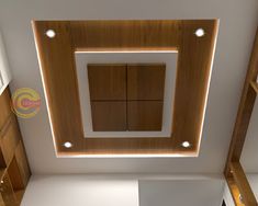 an overhead view of a kitchen with white counter tops and wooden cabinetry on the walls