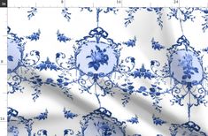 a blue and white fabric with flowers on it