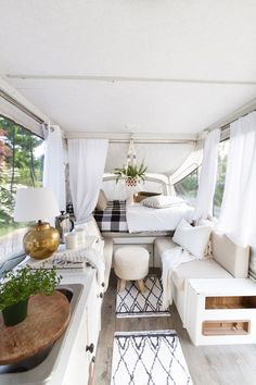 the interior of a camper is clean and ready to be used as a bed