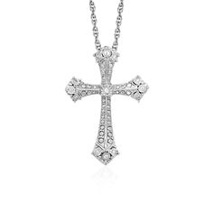 The shine of diamonds adds depth and beauty to this elegant Gothic style cross pendant in sterling silver. The pendant is 18 inches long and closes with a lobster clasp. Pendant Information Chain Length 18 inches Item Width 0.75 inches Item Height 1.00 inches Chain Type Cable Clasp Type Lobster Clasp Setting Type Prongs Rhodium Polish Yes Avaliable Sizes 18 Metal 925 Sterling Silver Diamond Information Min ct. tw. 0.04 Shape Round Average Color J Average Clarity I2 Ring Size Number Of Diamonds T Gothic Cross, Silver Ring Designs, Elegant Gothic, Sterling Silver Rings Set, Diamond Cross Pendants, Diamond Cross, Cross Jewelry, Sterling Silver Cross, Gothic Style