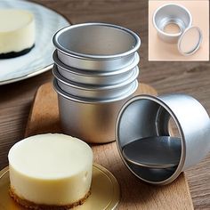 there are four different types of pie pans on the table and one is empty