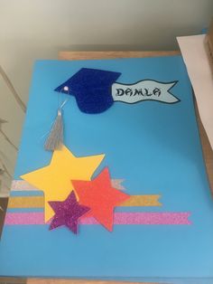 a blue sheet with stars and a graduation cap on it that says dalmaa