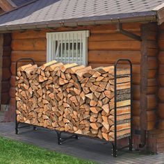 a pile of logs sitting in front of a building