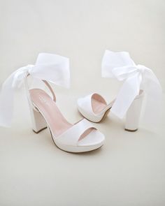 Tie Up Shoes, Pretty White Heels, Bridal Shoes With Bows, White Ankle Wrap Heels, Cute Prom Shoes, Graduation Heels College, White Heels With Bow, White Heels With Bow For Events, Summer White Heels With Satin Bow