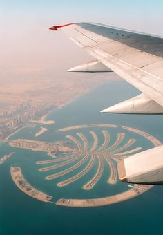 an aerial view of the palm island in the middle of the ocean, taken from above