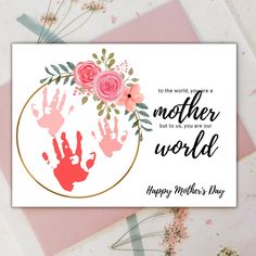 a mothers day card with pink roses and hand prints