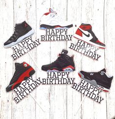 happy birthday cupcake toppers with air jordan shoes on white wood planks background