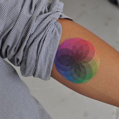 a person with a colorful tattoo on their arm