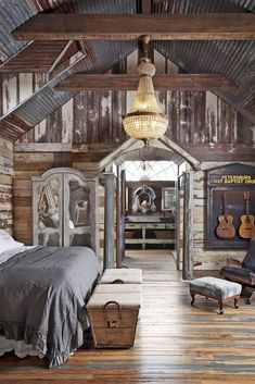 a bedroom with wooden floors and walls