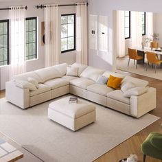 a living room filled with furniture and lots of windows