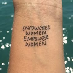 a woman's wrist with the words emowed women emower women written on it