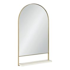 a mirror sitting on top of a white shelf