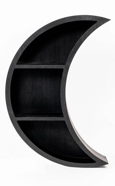 a black book shelf with a crescent shaped section