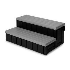 two black plastic benches sitting next to each other