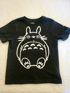 a black tshirt with a totoro drawn on it