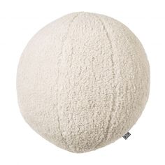 a white round pillow on a white background