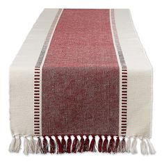 a red and white table runner with tassels