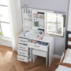 a white desk with drawers and a mirror