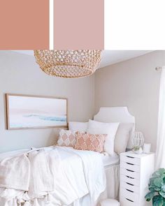 a bedroom with white furniture and pink accents