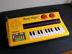 a yellow electronic keyboard sitting on top of a table