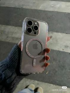 someone holding up their iphone case with the camera on it