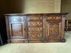 a large wooden dresser with many drawers