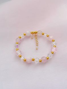 Add a touch of elegance and charm to your style with the Pink & Gold Beaded Bracelet - Dainty Coquette. This delicate, handmade bracelet features a beautiful combination of soft pink and gold beads, creating a feminine and sophisticated accessory that's perfect for any occasion. Whether you're dressing up for a special event or adding a subtle touch of glamour to your everyday look, this bracelet is the ideal choice. Crafted with attention to detail, the Pink & Gold Beaded Bracelet is lightweigh Pink Adjustable Dainty Bracelets, Dainty Pink Beaded Bracelets, Pink Dainty Beads For Gifts, Handmade Pink Dainty Crystal Bracelet, Dainty Coquette, Dainty Pink 14k Gold-filled Bracelets, Gold Beaded Bracelet, Rosa Gold, Bracelet Dainty