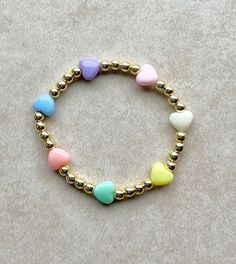 Trendy Gold Beaded Heart Bracelet, Cute Handmade Gold Beaded Bracelets, Sweet Multicolor Heart-shaped Jewelry, Playful Gold Beaded Bracelets For Everyday, Gold Bracelets With Heart Charm For Birthday, Gold Heart-shaped Beaded Bracelet For Birthday, Gold Bracelet With Heart Charm For Birthday, Cute Multicolor Heart Bracelet For Gift, Cute Personalized Gold Stretch Bracelet